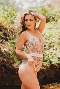 Jackson boudoir photography woman outdoors in nature in floral lingerie bodysuit