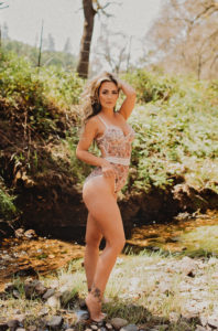 Jackson boudoir photography woman outdoors in nature in floral lingerie bodysuit