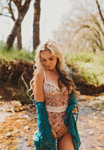 Jackson boudoir photography woman outdoors in nature in floral lingerie bodysuit