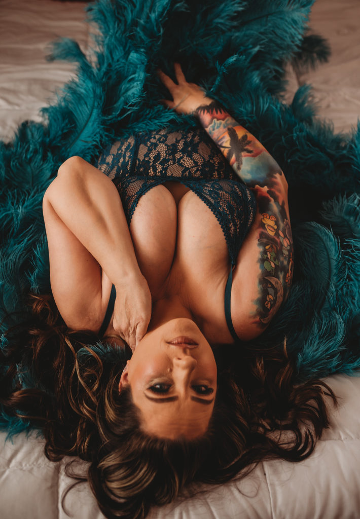 Folsom boudoir photography woman with tattoos in teal blue angel wings