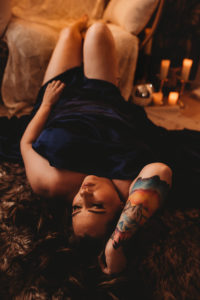 Folsom boudoir fine art implied nude photography woman in satin sheet