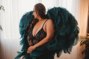 Folsom boudoir photography woman with tattoos in teal blue angel wings
