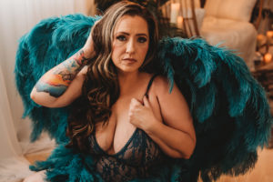 Folsom boudoir photography woman with tattoos in teal blue angel wings