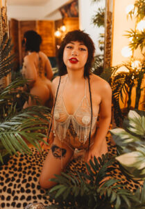 Non Binary Human on leopard rug during Limitless Boudoir photoshoot